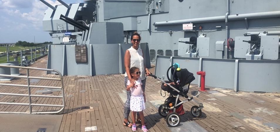 Family exploring the USS Alabama battleship in Mobile, Alabama.