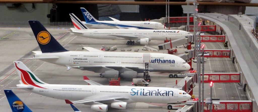 Multiple airplanes parked at the gates of an airport