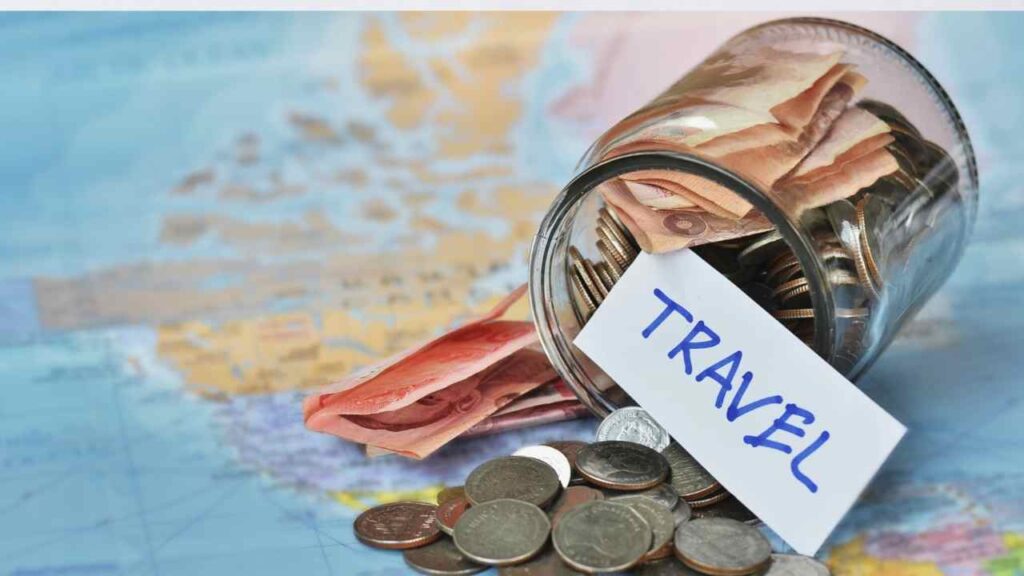 Travel budget and money management for families with a jar labeled "Travel" filled with coins and banknotes on a world map.