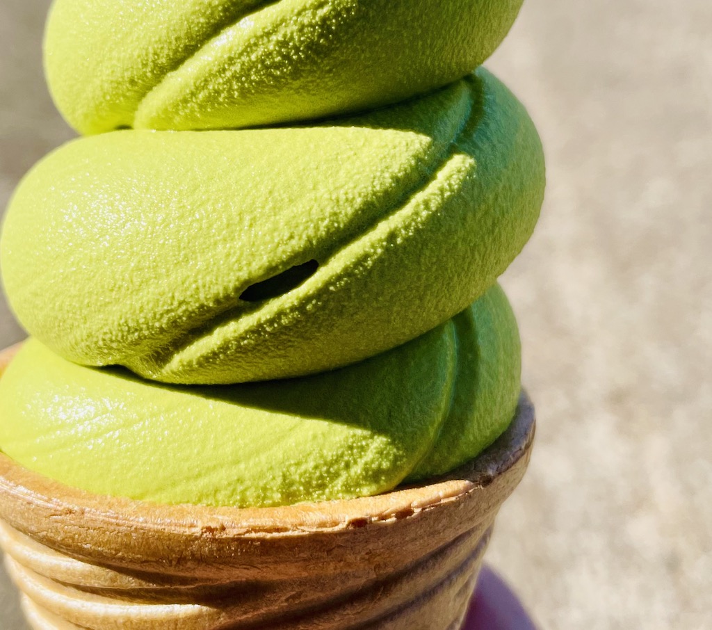 Matcha green tea soft serve ice cream close-up.