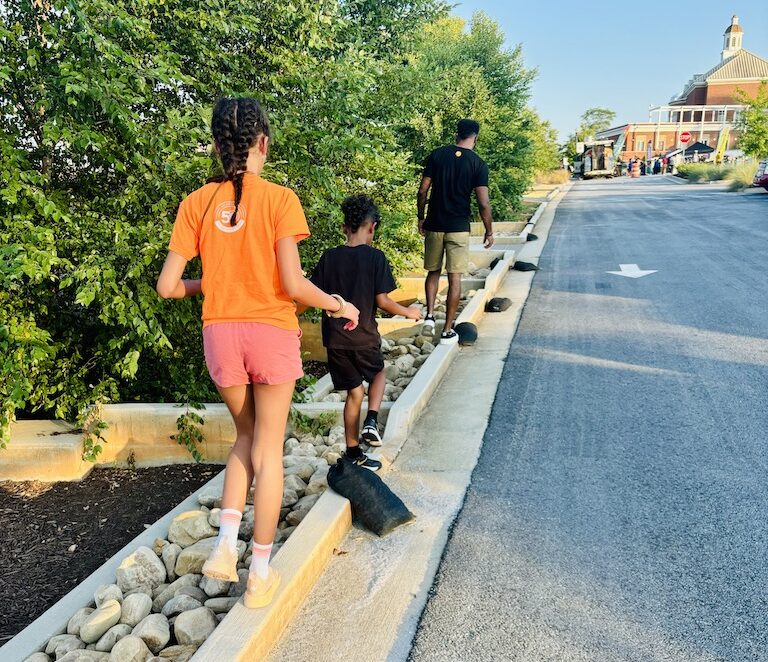 Family walking towards Stockbridge Amphitheater