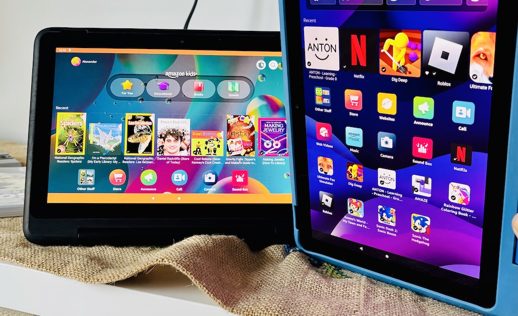 Amazon Fire HD 10 Kids tablet home screen showing educational apps like National Geographic and Audible, perfect for kids' travel entertainment.