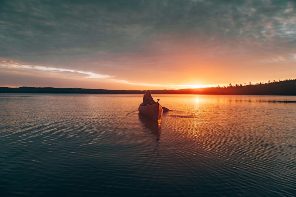 Family kayaking at sunset on Lake Oconee during an Oconee County SC family trip.